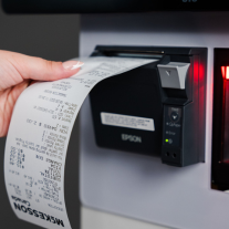 Close up of a receipt coming out of a self-checkout machine